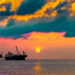 Offshore Oil Exploration – Adriatic Coast, Italy Oil rig and tanker in the Adriatic Sea off Italy, part of GEO Exploration’s offshore hydrocarbon project.